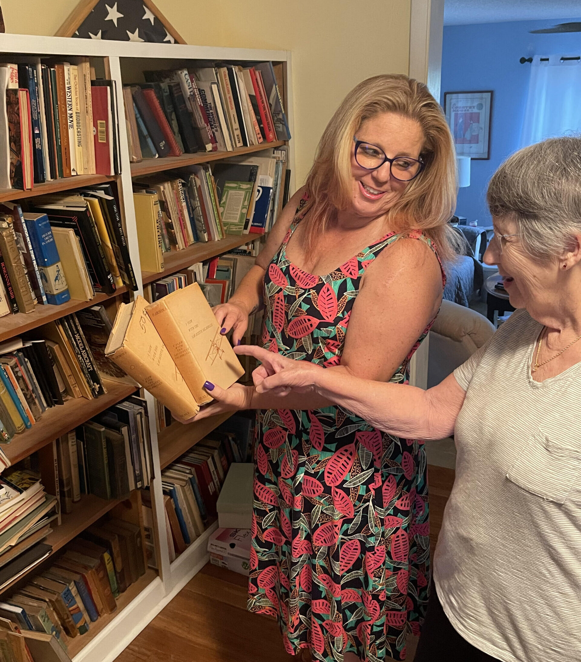 Mary and Client reviewing books during estate liquidation