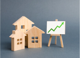 Image showing wooden block houses with graph in positive direction